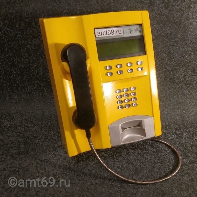 Желтый таксофон